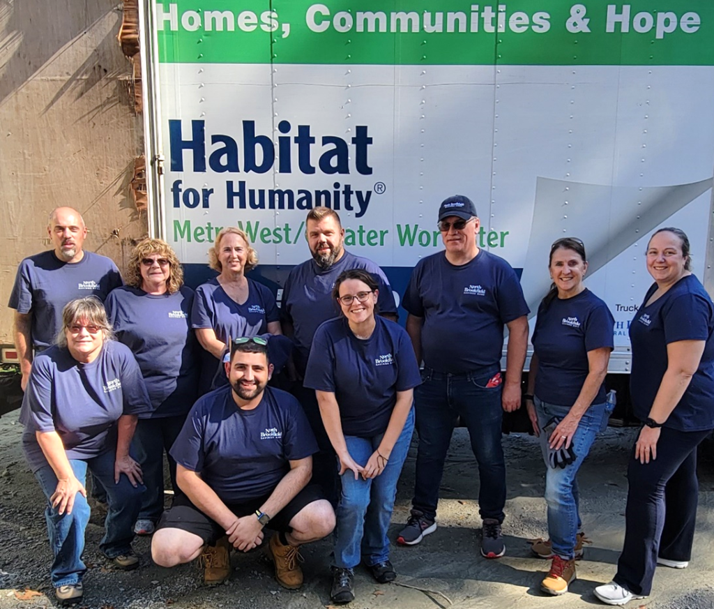 NBSB staff pose for a photo at the Habitat for Humanity Build Project in Worcester, MA.