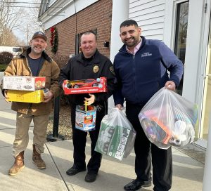 NBSB Employee Joseph Ribeiro featured outside of our West Brookfield Branch assisting “Farmer Matt” Koziol and West Brookfield Police Chief, Nathan Hagglund with our donation of Toys from NBSB’s Annual Toy Drive Collection Fundraiser. 